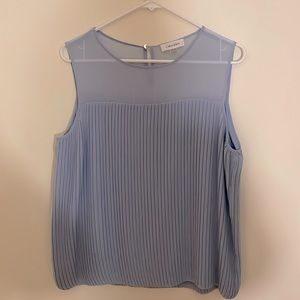 Light blue, mesh neckline blouse. Great layering option for work or play.